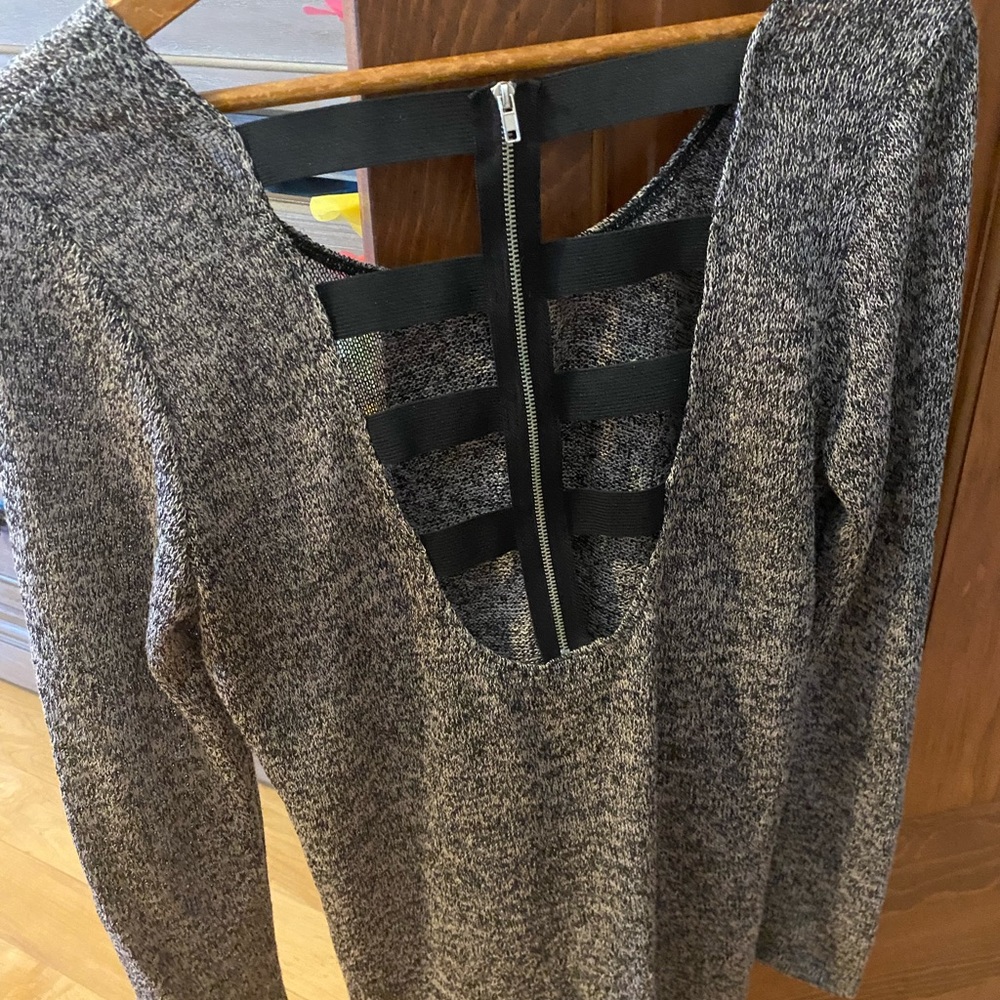 Barely worn blouse top. Cool cutout back. Very thin material!